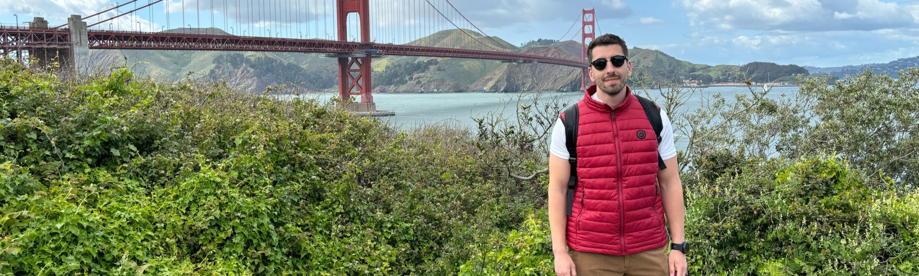 Foivos Tsimpourlas standing in front of the Golden Gate Bridge.